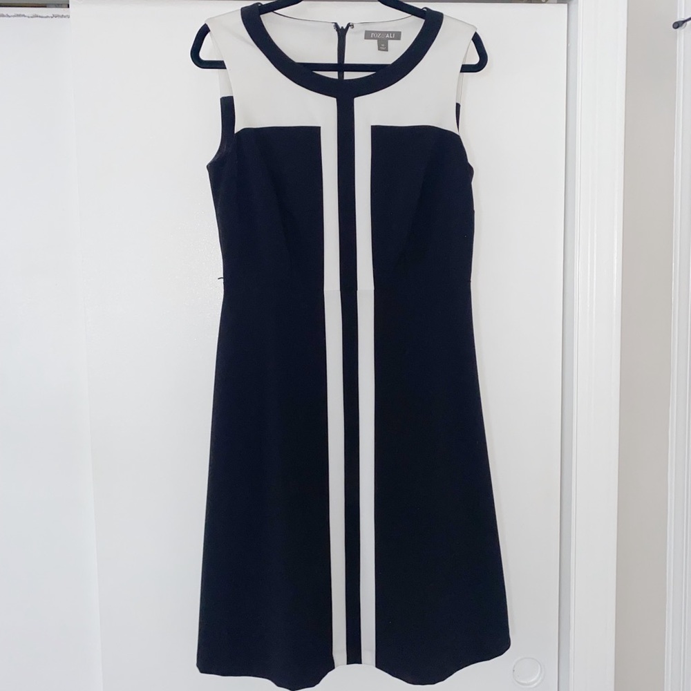 Mid-length black and white dress.